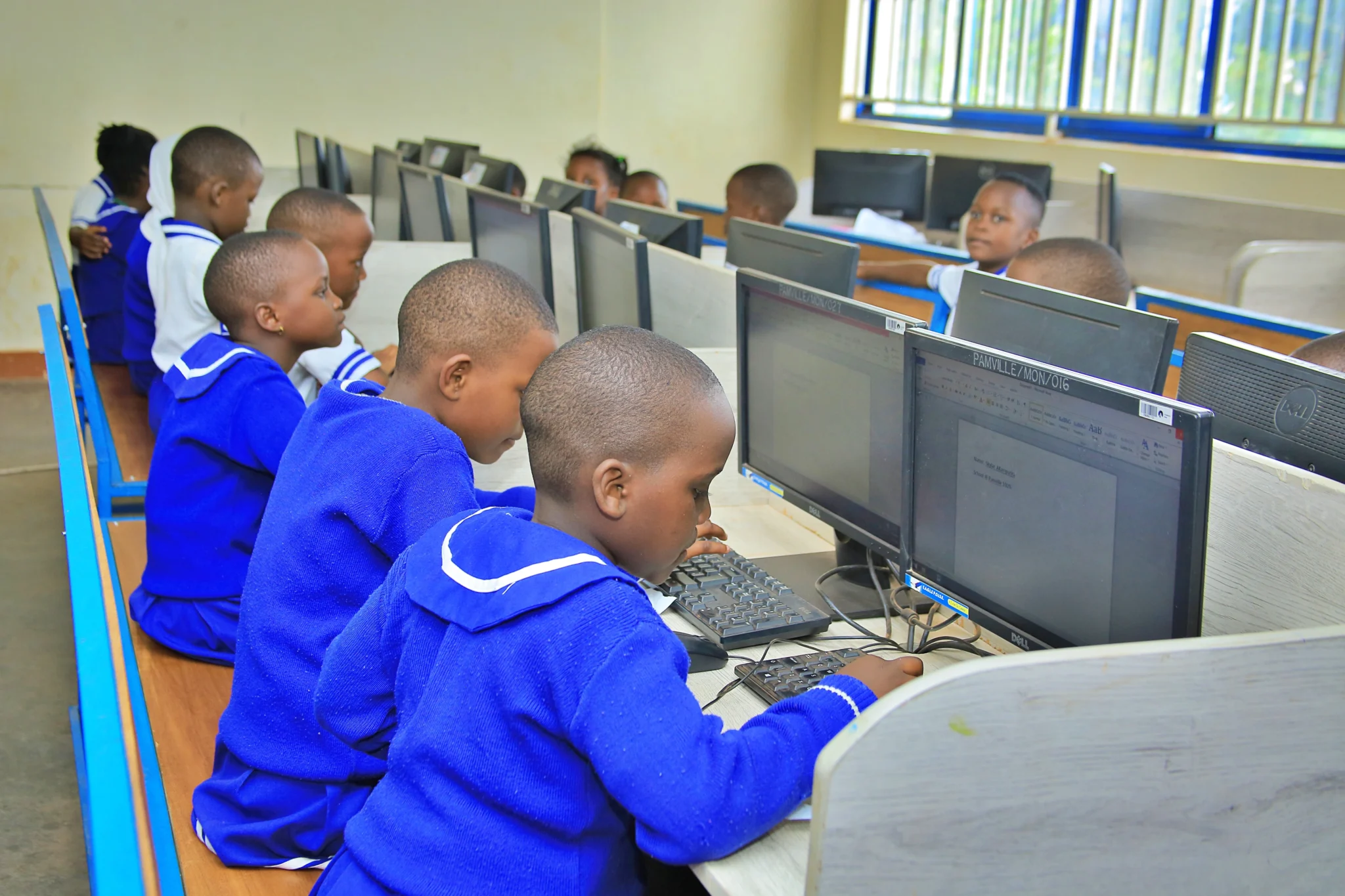 Pamville learners practising computer skills in the ICT laboratory