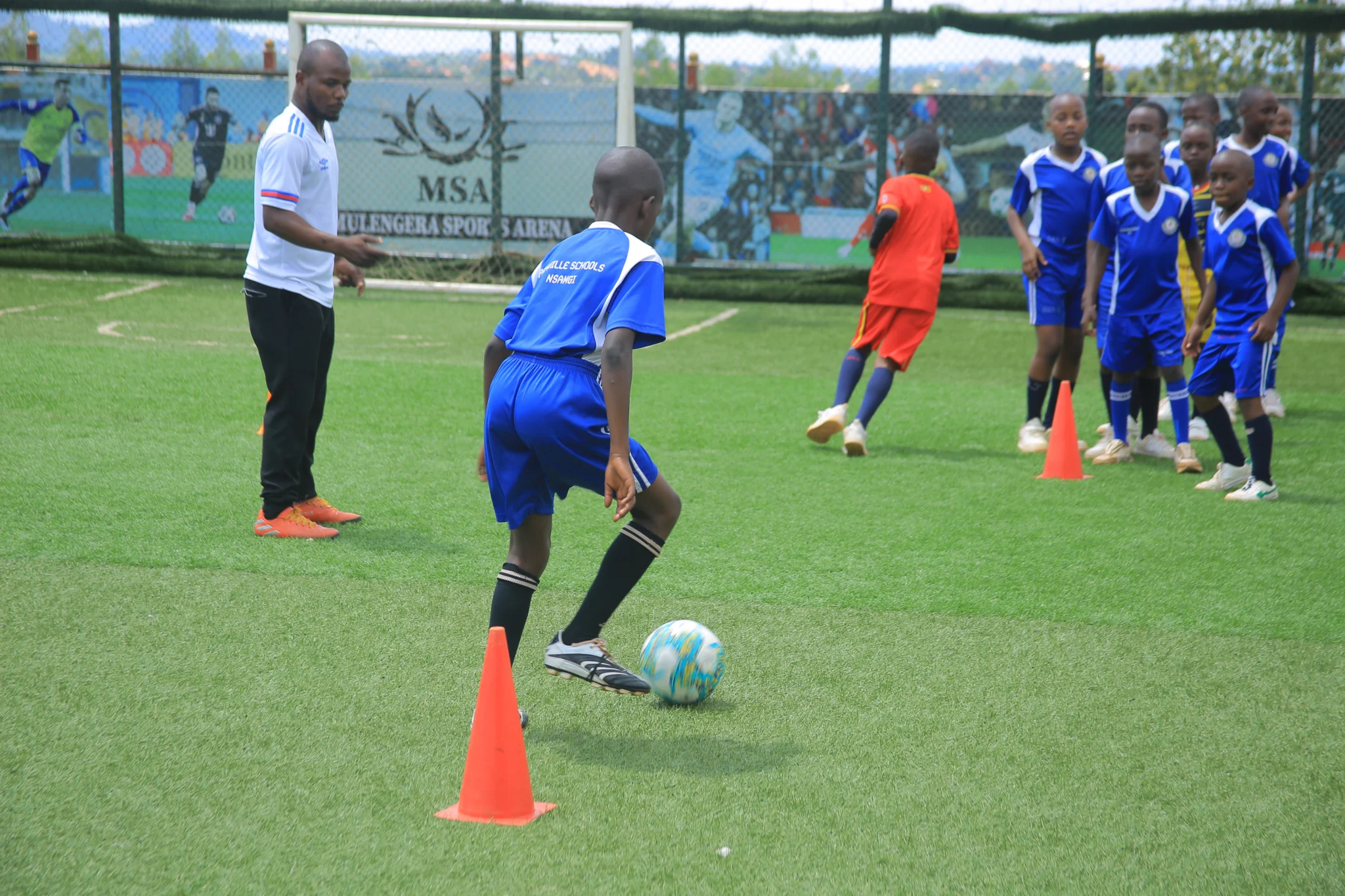 Pamville pupils playing football together