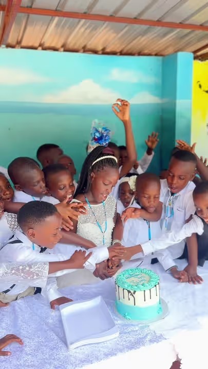 Pamville First Holy Communion celebrants gathered around a celebration cake
